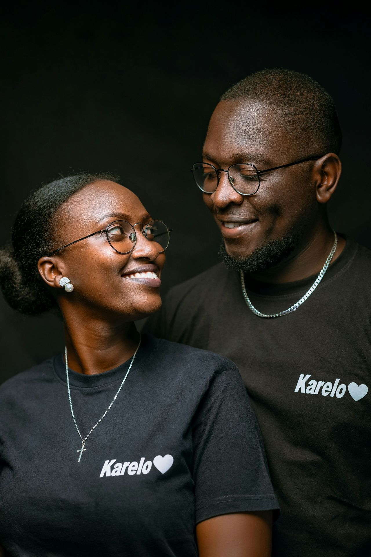 a man and a woman smiling at each other